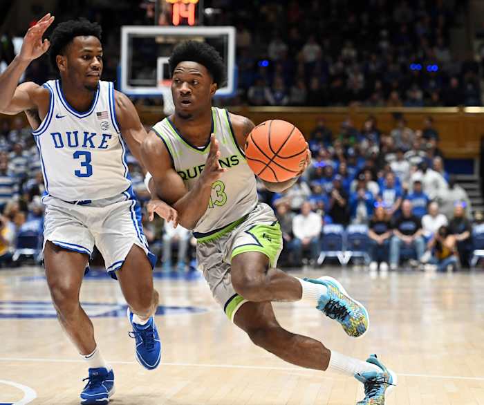 Queens Royals guard Deyton Albury (13) drives to the basket as Duke Blue Devils guard Jeremy Roach (3) defends during the first half at Cameron Indoor Stadium.